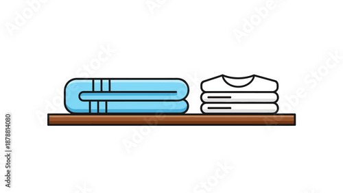 Folded blue towels and white tshirts on a brown shelf
