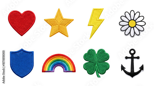 Embroidered patch set including heart, star, bolt, daisy, shield, rainbow, clover, and anchor isolated. Decorative sewing and fashion accessory collection.