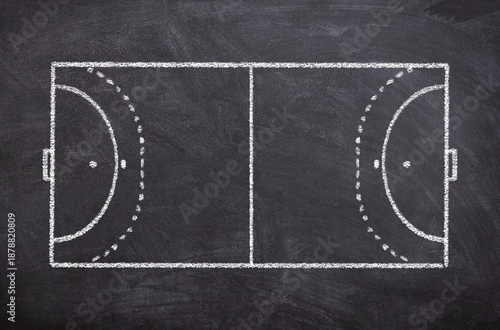 Hand drawn chalk sketch on blackboard shows a handball court and symbolizes sport game tactics and teamwork