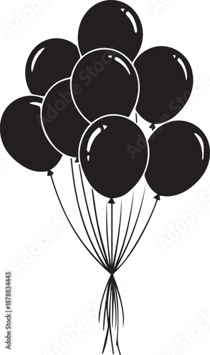 Black balloons tied together in a bunch floating freely