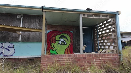 Graffiti of Woman on Abandoned Ruined Building Shack