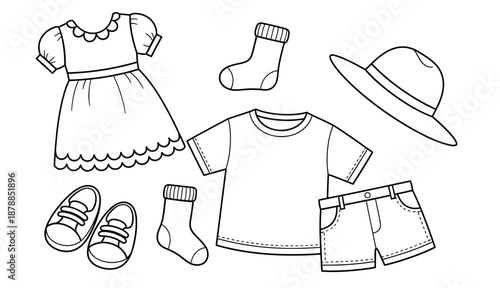 Collection of children's clothing items including a dress, t-shirt, shorts, socks, shoes, and a hat, arranged creatively for a playful fashion illustration concept with copy space