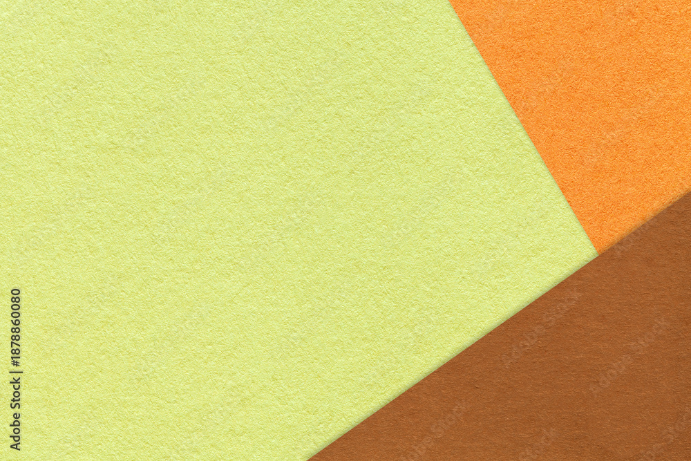 Fototapeta premium Abstract light green, orange and brown paper background with copy space. Template for presentation, banner, card design