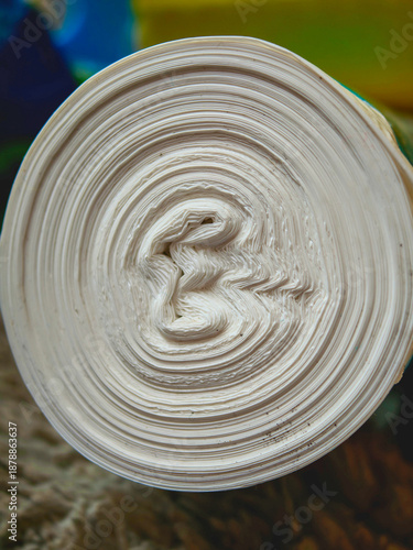 Rolled paper creating abstract spiral texture pattern