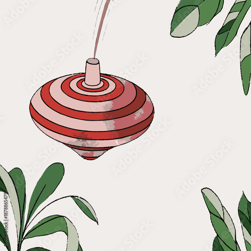 Spinning top amidst green leaves