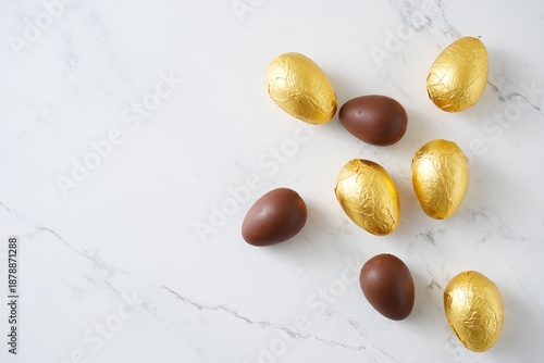 Elegant Chocolate Easter Eggs Flat Lay with Marble Background