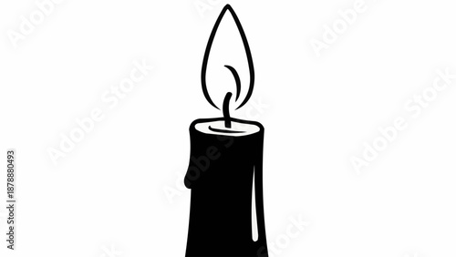 Black candle with a bright flame burning.