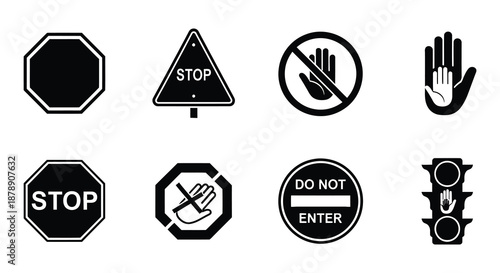 Collection of black and white stop signs and hand halt symbols displayed