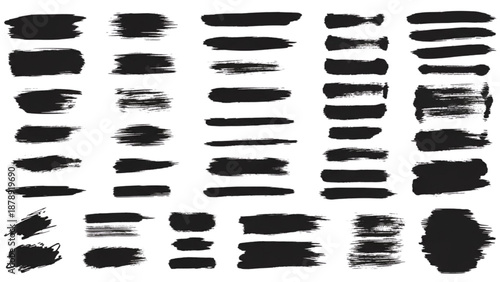Collection of diverse black brush strokes and smudges on a clean surface from various viewpoints