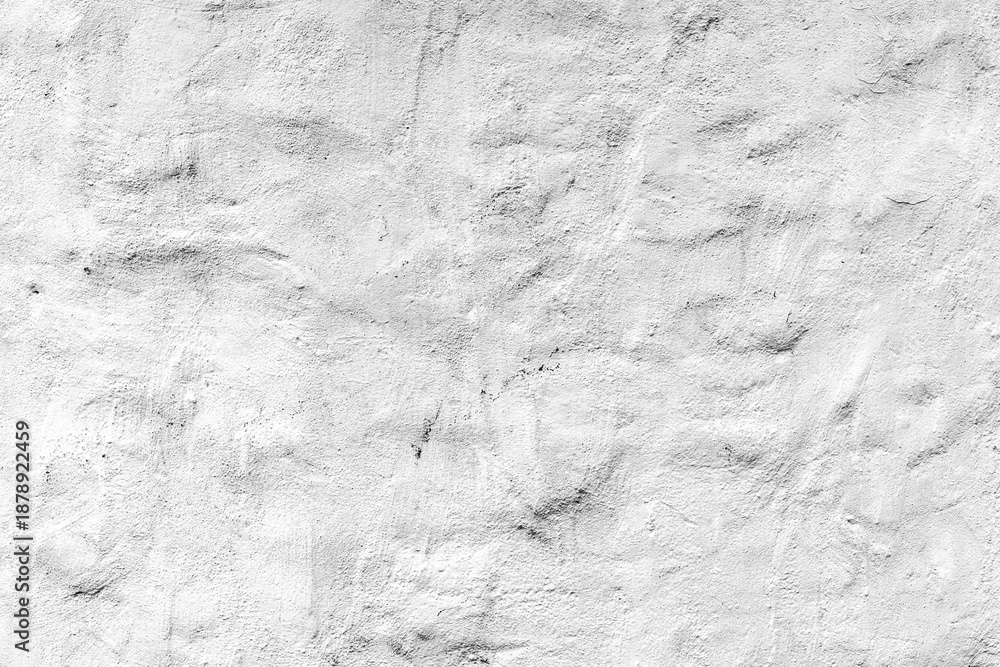Obraz premium Textured white concrete wall with subtle imperfections and natural lighting