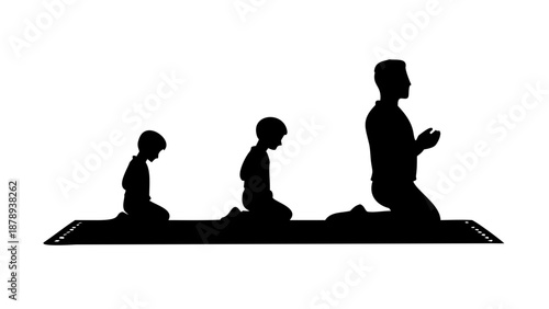 A silhouette of a father leading prayer with his two young sons standing in a row behind him on prayer mats