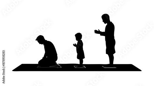 A silhouette of a father leading prayer with his two young sons standing in a row behind him on prayer mats