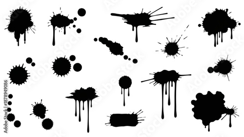 Collection of black ink splatters and sprays on a clean surface from a direct viewpoint