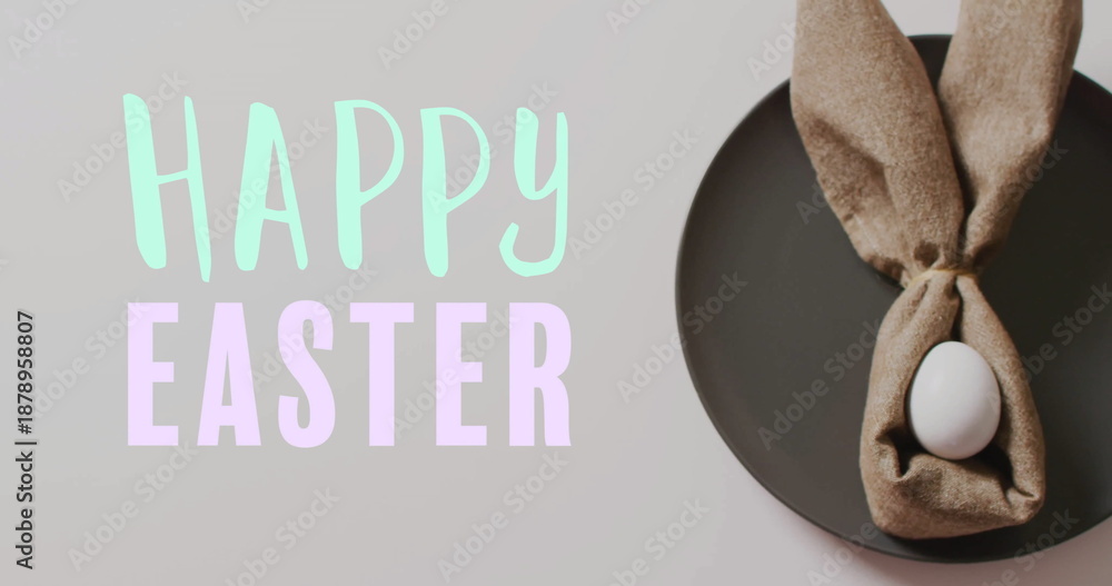 Obraz premium Image of happy easter text over easter eggs in cloth on white background