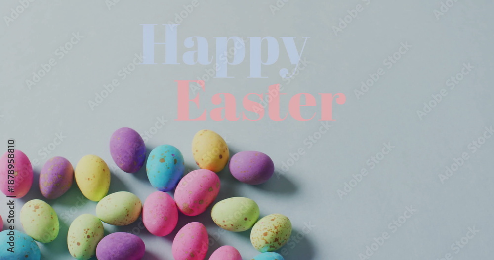 Fototapeta premium Image of happy easter text over colourful easter eggs on grey background