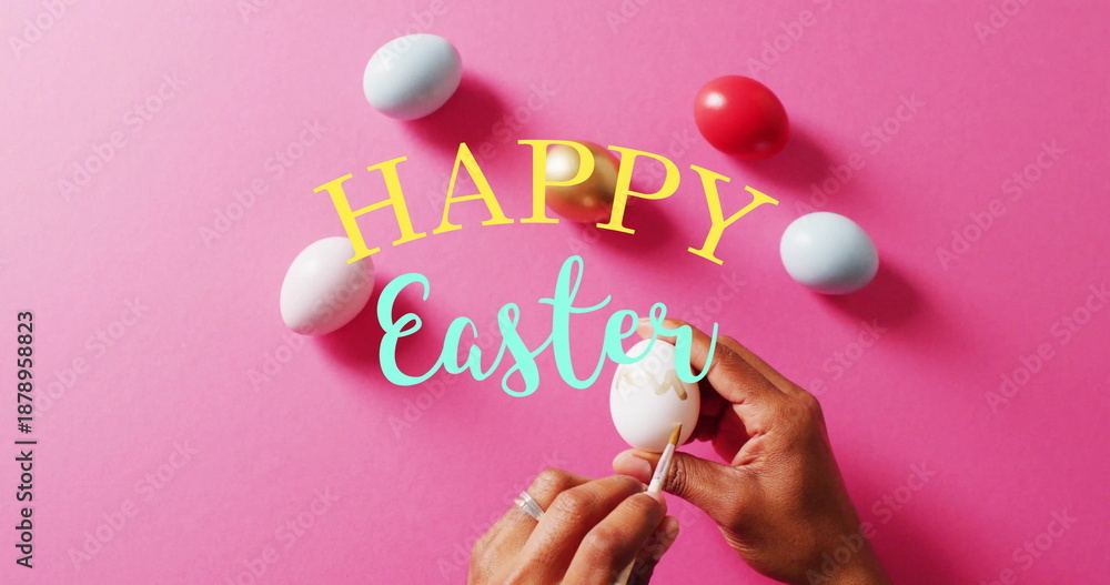Fototapeta premium Image of happy easter text over woman painting colourful easter eggs on pink background