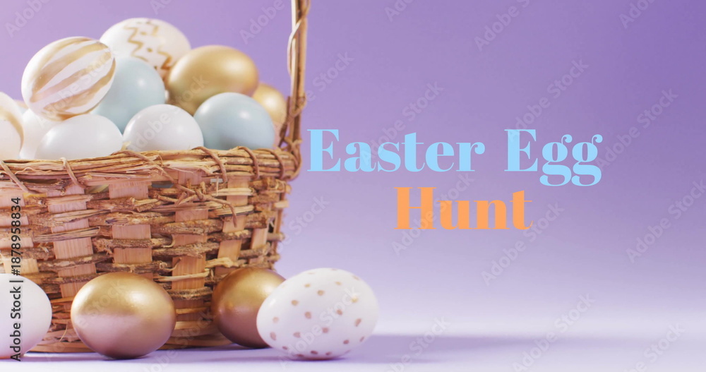 Fototapeta premium Image of easter egg hunt text over colourful easter eggs in basket on purple background