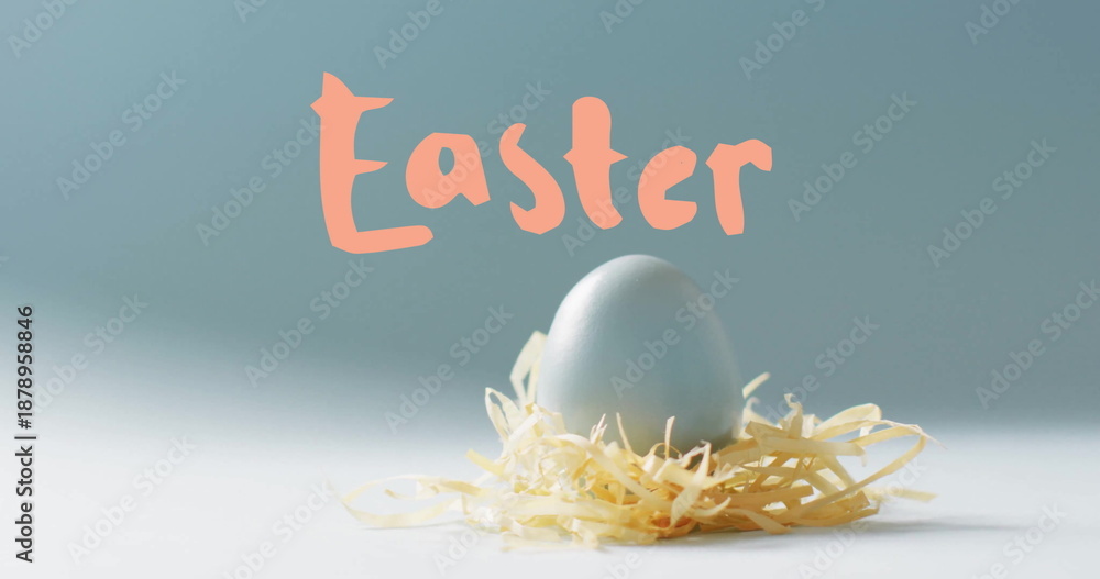 Fototapeta premium Image of easter text over blue easter egg in hey on blue background
