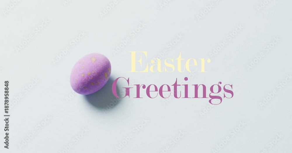 Naklejka premium Image of happy greetings text over purple easter egg on bue background