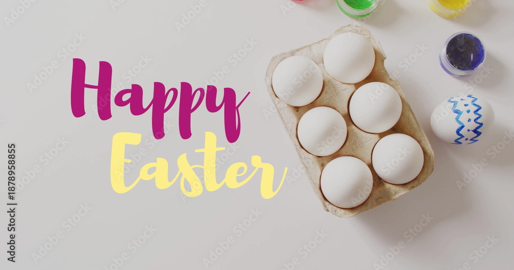Obraz premium Image of happy easter text over easter eggs and paints on white background