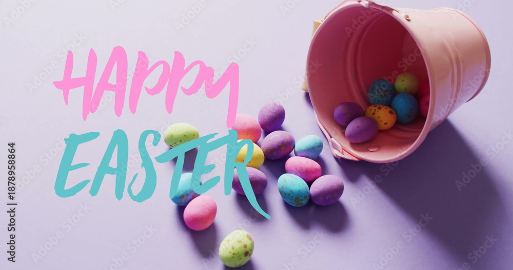 Fototapeta premium Image of happy easter text over colourful easter eggs on purple background