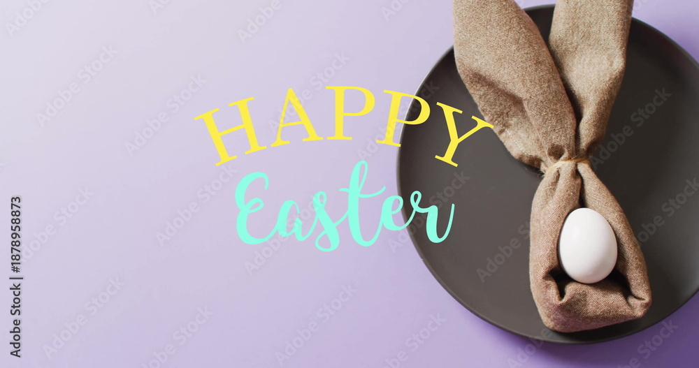 Fototapeta premium Image of happy easter text over white easter egg in cloth on purple background