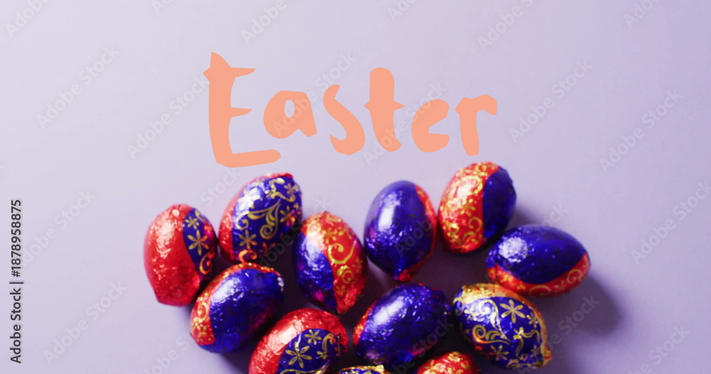 Fototapeta premium Image of easter text over colourful easter eggs on purple background