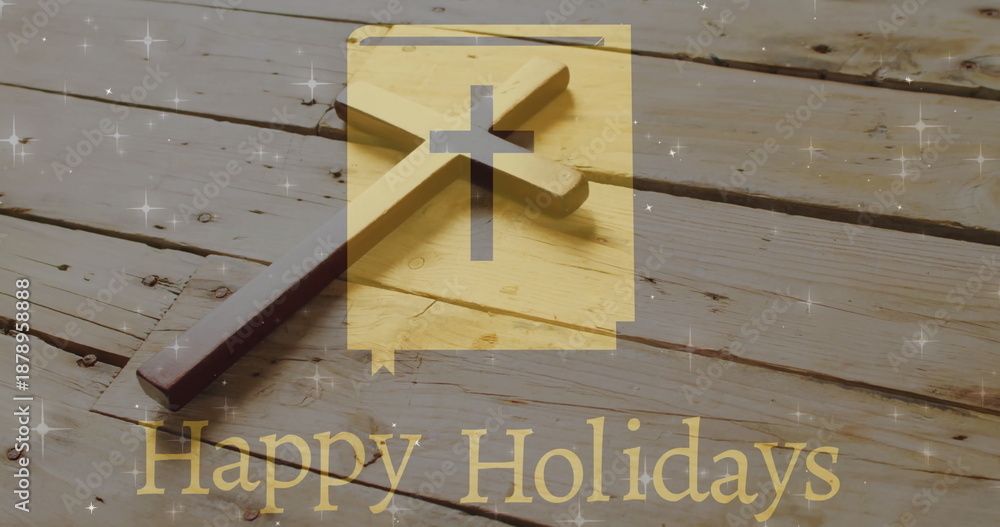 Fototapeta premium Image of happy holidays text over christian cross on wooden background