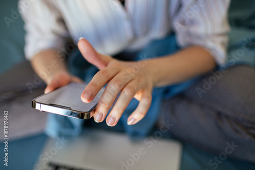 Close-up of person using smartphone at home