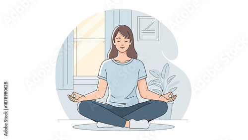 Young woman meditates peacefully while sitting cross legged indoors with eyes closed in a calm room full of natural light