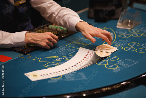 Cuadro en lienzo Casino Dealer Dealing Cards at Poker Table with Chips