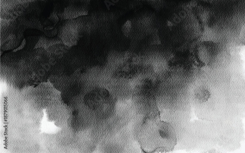 Irregular black watercolor blot with fine ink droplets and artistic grunge texture for banners.