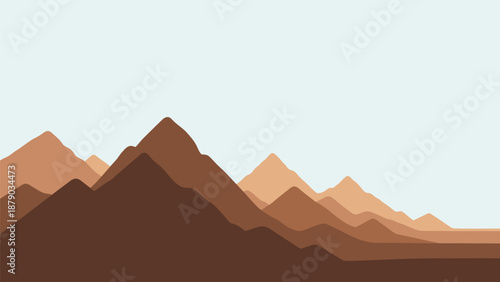 Stunning mountain landscape with brown peaks under clear sky