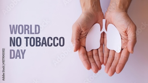 Hands holding paper lungs for world no tobacco day.