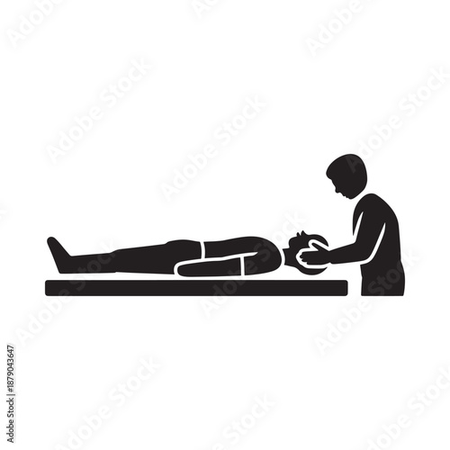Silhouette of a person receiving a head massage or treatment lying down