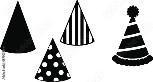 A set of four black and white party hats on a plain white background