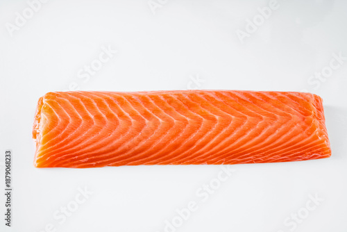 Piece of Raw Salmon Fillet for Sushi on a White Background