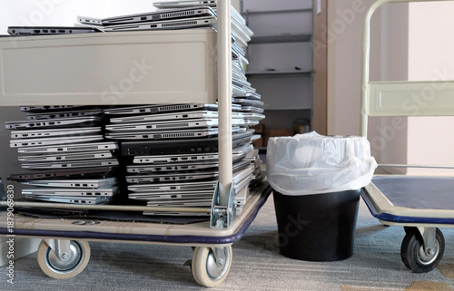 Electronic waste - stack of laptops to be discarded