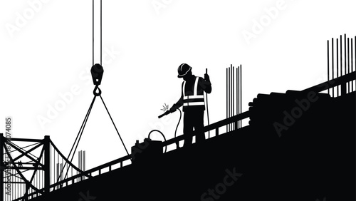 A construction worker directs a crane lifting materials on a building site portrayed as a striking black and white silhouette