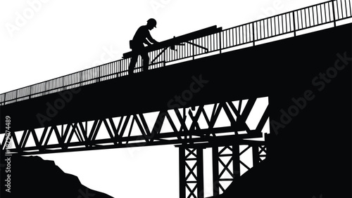 A solitary worker is shown in profile operating machinery atop a massive steel bridge structure creating a striking silhouette high quality
