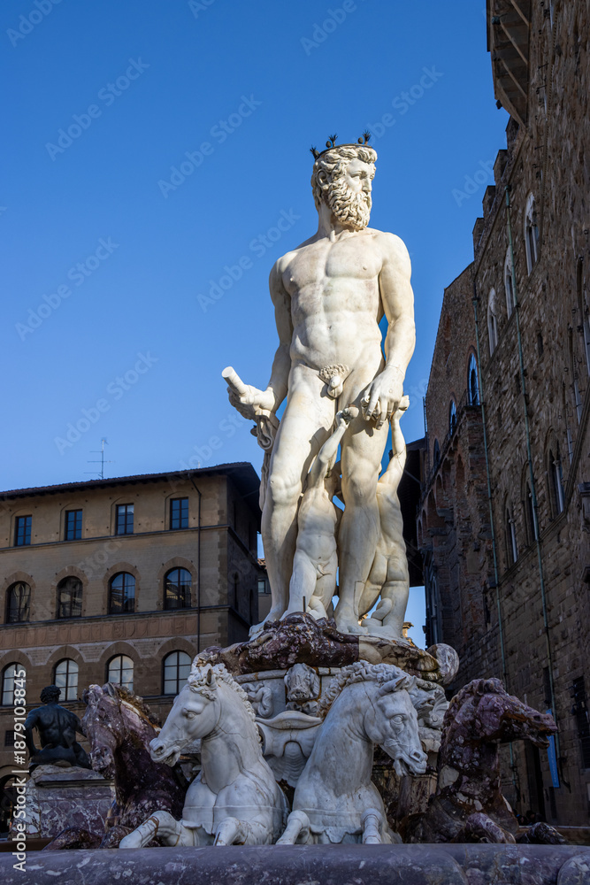 Naklejka premium The Fountain of Neptune in Florence's Piazza della Signoria, in front of the Palazzo Vecchio, is crowned by a majestic marble statue of the god Neptune. Italy