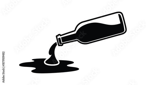 Black liquid pouring from a bottle creating a spill on a surface