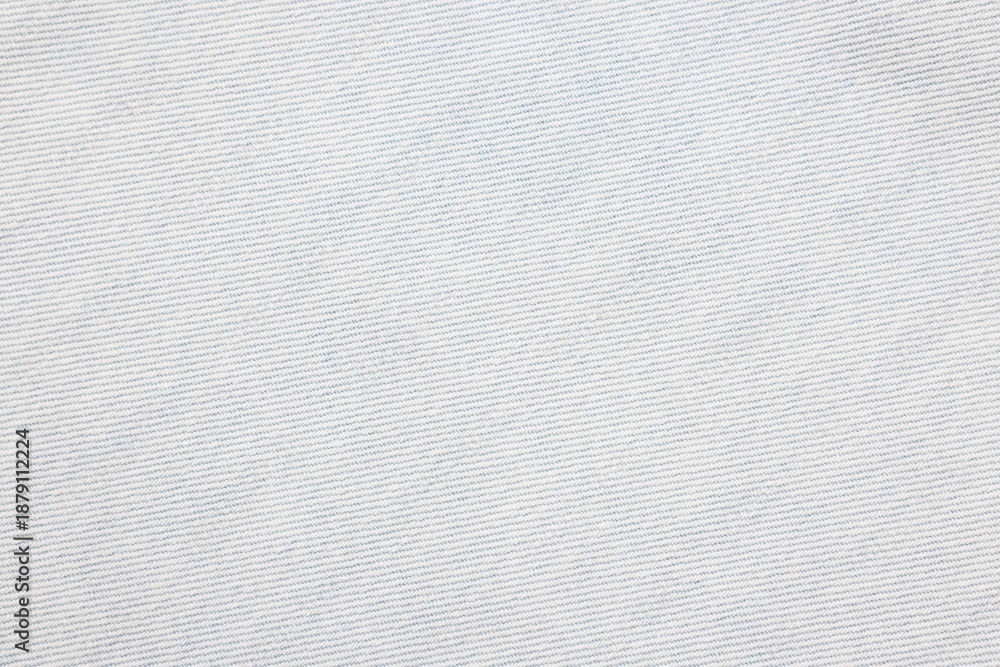 Fototapeta premium Texture of light blue denim fabric as background, top view
