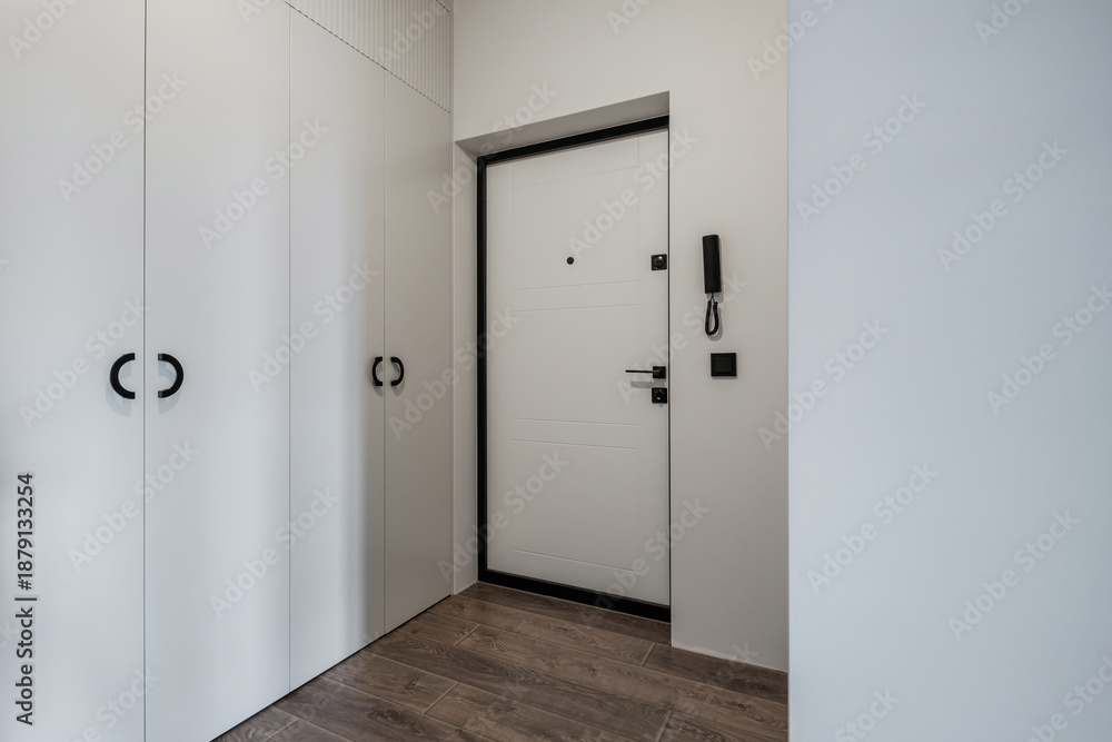 Obraz premium long empty corridor in interior of entrance hall without furniture of modern apartments, office or clinic