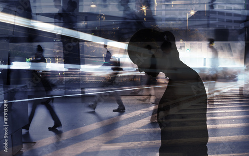 Lonely Figure in Fast-Paced Urban Crowd
