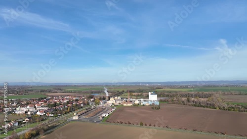 Sugar beet food processing factory aerial drone view slow motion video at Central Moravia Czech Republic. Building and house construction site, residential and commercial area farming and agricultural