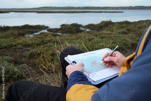 Coastal Scientist Mapping Sea Level Rise and Environmental Impact on Salt Marsh