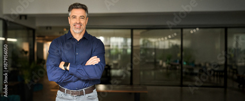 Fotografija Portrait of happy mature 50 year old professional business owner man manager, smiling senior male ceo executive, middle aged corporate leader looking at camera standing arms crossed in office at work