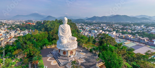Quadro su tela Aerial panorama view Majestic Buddha statue overlooking Nha Trang cityscape with mountainous backdrop, landmark of Vietnam