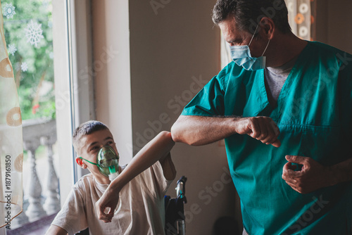Doctor Caring for Disabled Child in Wheelchair